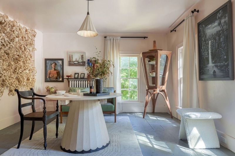 Eclectic Dining Room with Fluted Pedestal Table & Faceted Curio Cabinet