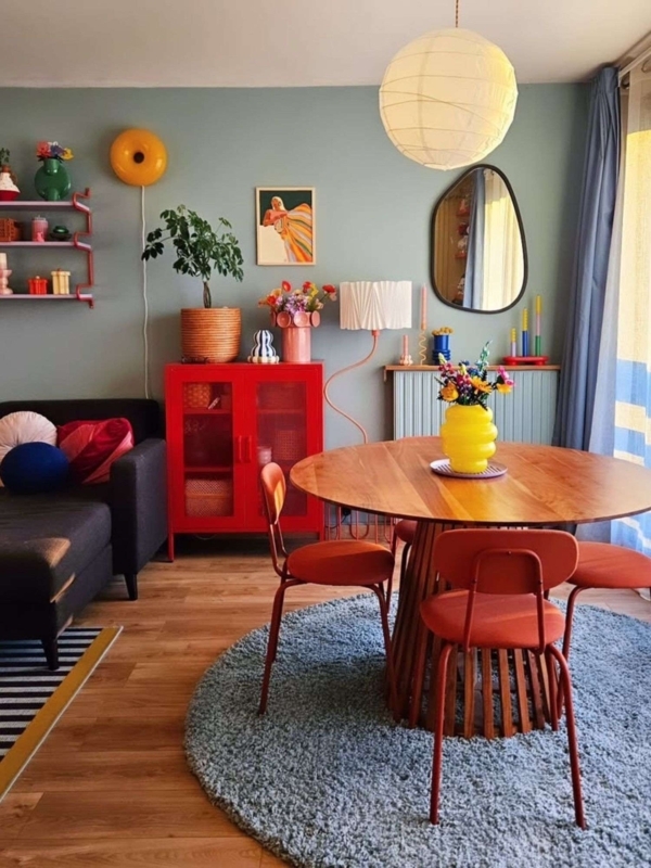 Eclectic Dining Room with Wavy Floor Lamp and Wood Table