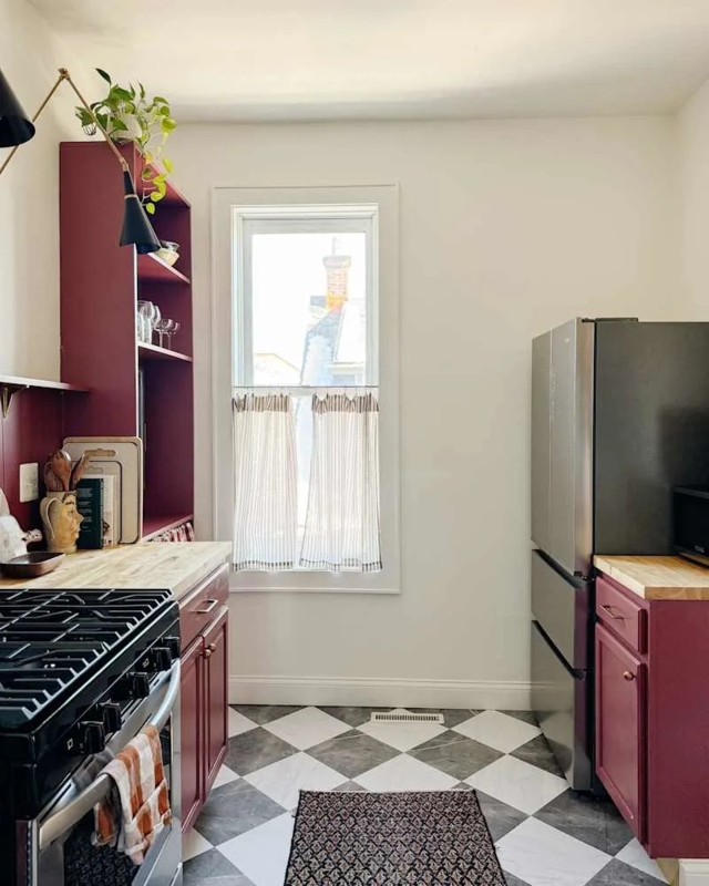 Eclectic Galley Kitchen: Burgundy Cabinets, Harlequin Floor, Cafe Curtains