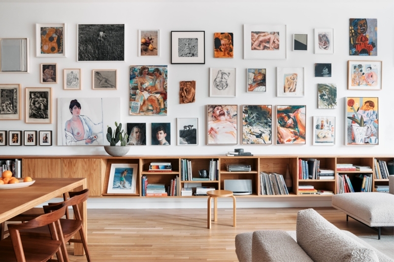 Eclectic Living Dining Room: Wall-to-Wall Bookshelf & Boucle Texture