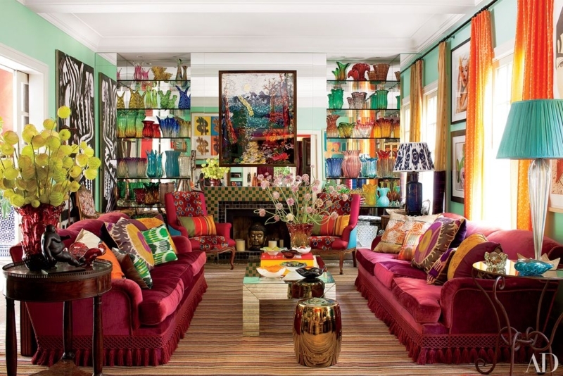 Eclectic Living Room: Fringed Magenta Sofas and Rainbow Glassware