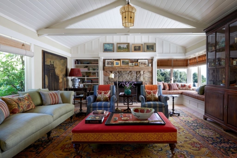 Eclectic Living Room with Stone Fireplace & Vaulted Ceiling