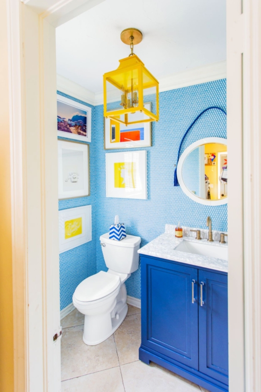 Eclectic Powder Room with Blue Vanity, Yellow Lantern and Patterned Wallpaper