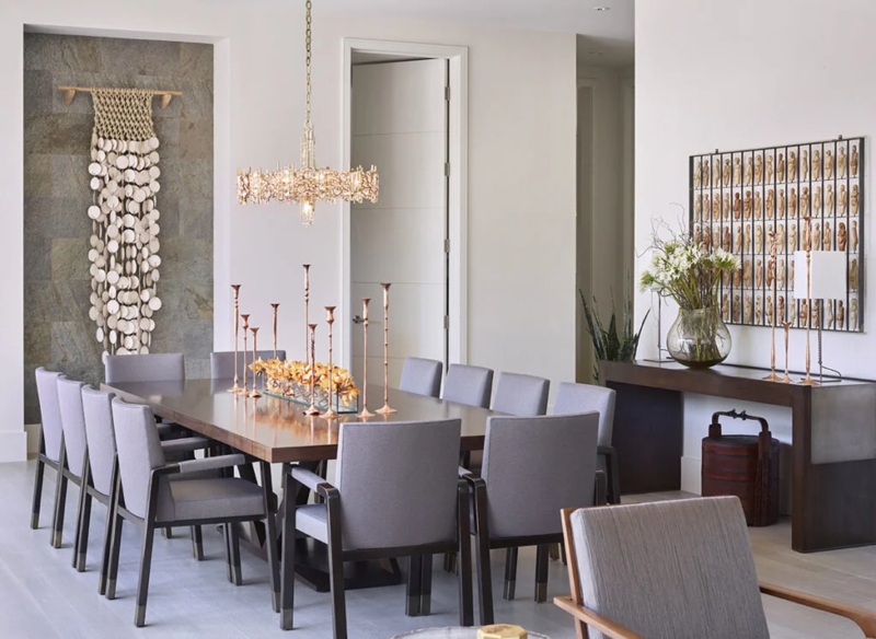 Elegant Luxury Dining Room with crystal chandelier and stone wall niche.