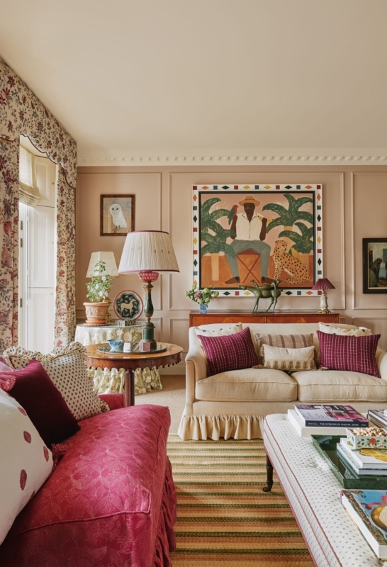 English Country Living Room with Magenta Skirted Sofa and Patterns
