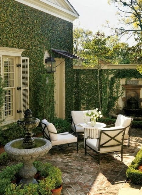 European Courtyard Patio with Ivy Covered Wall and X-Back Seating