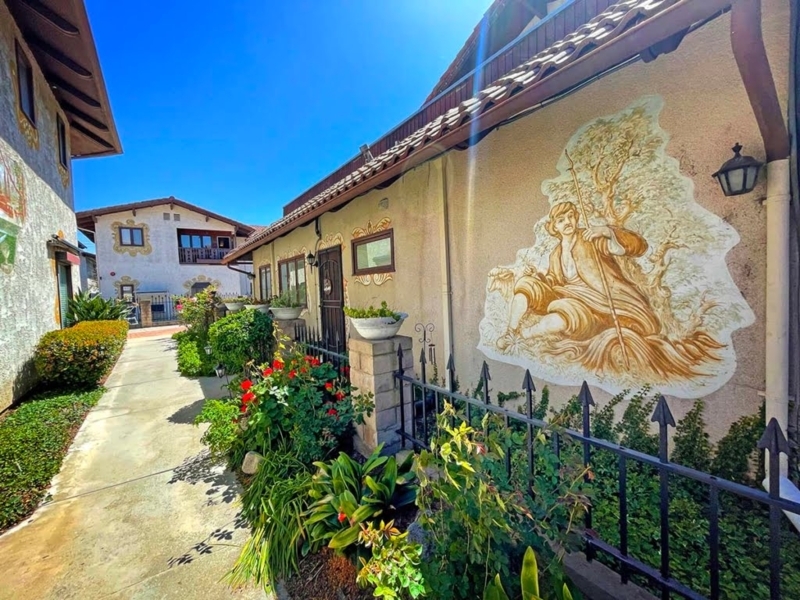European Village Walkway Figurative Wall Mural Wrought Iron Fence