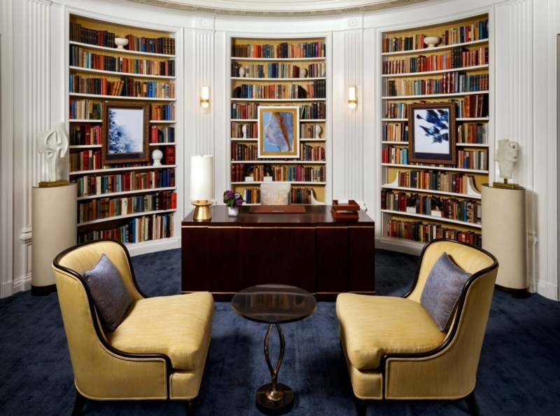 Executive Desk in Curved Library Shelving Layout with Mustard Chairs