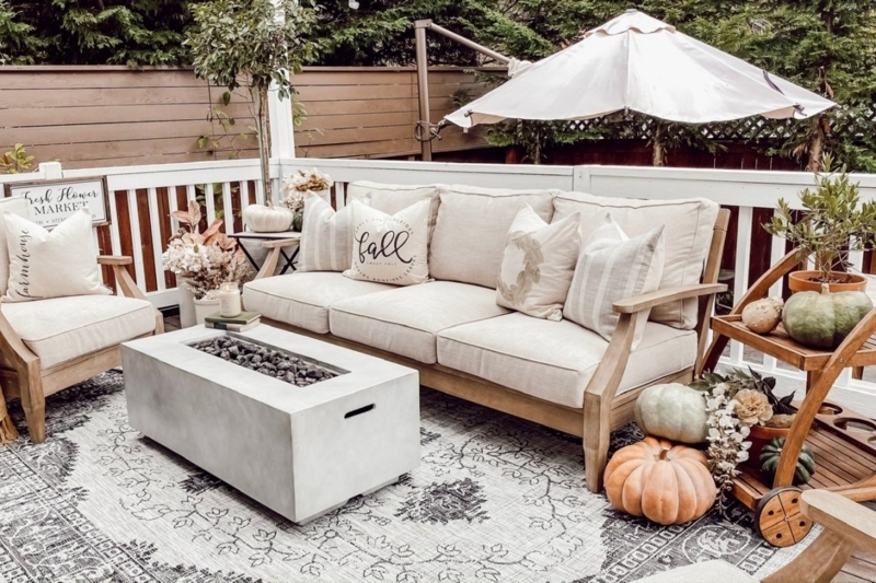 Farmhouse Deck with Concrete Fire Pit Table and Pumpkin Decor