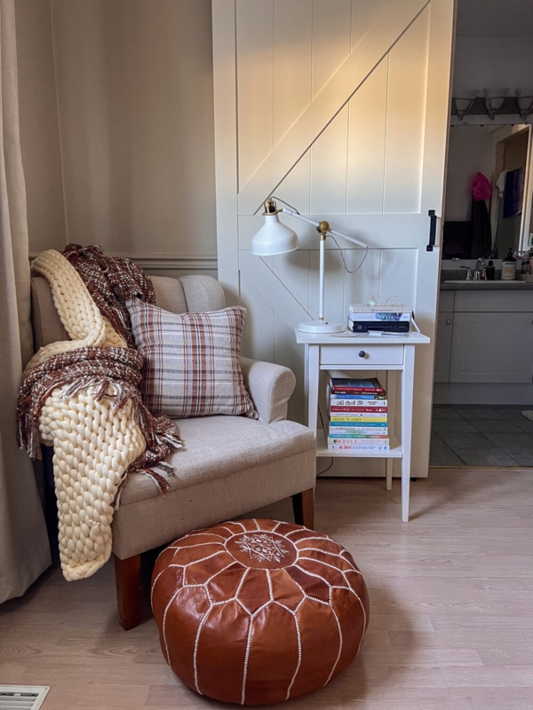 Farmhouse Reading Corner seating with sliding barn door backdrop.