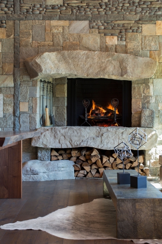 Fireplace Massive Stone Slabs Integrated Log Storage Rustic Style