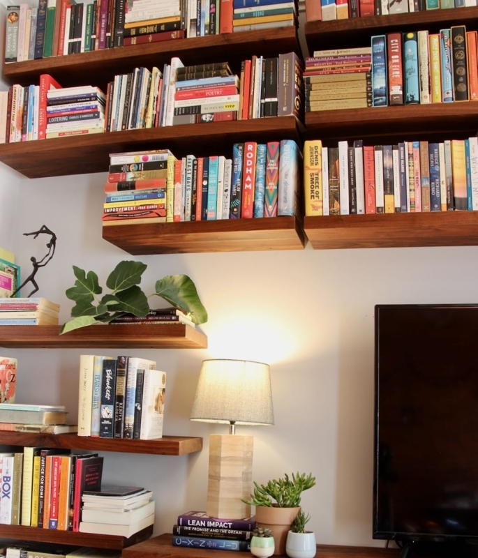 Floating Bookshelf Thick Wood Toned Dense Arrangement Staggered