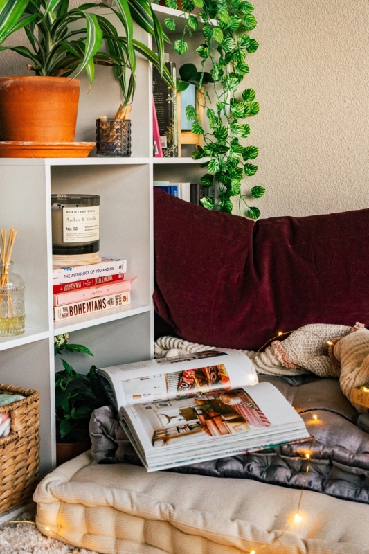 Floor Cushion Reading Nook with tufted seating and string lights.