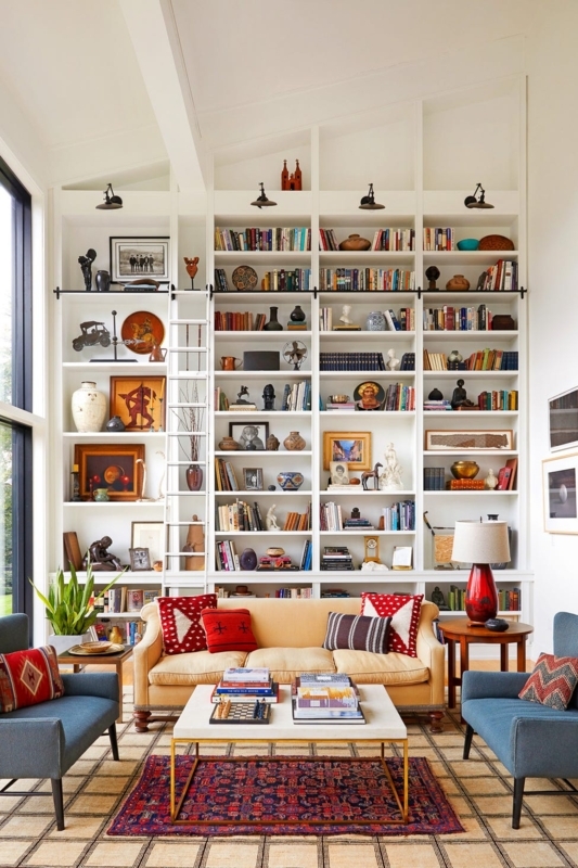 Floor-to-Ceiling Bookcase with Library Ladder in Eclectic Living Room