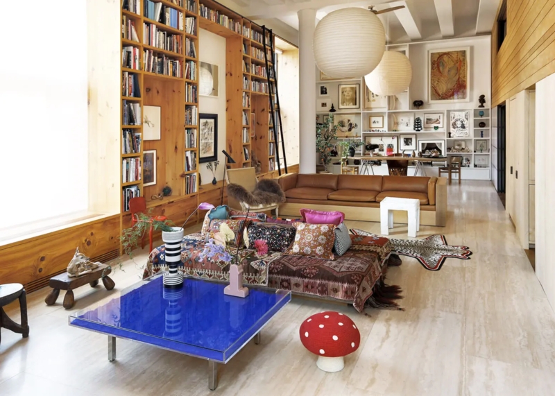 Floor-to-Ceiling Home Library in Eclectic Loft with Cobalt Table