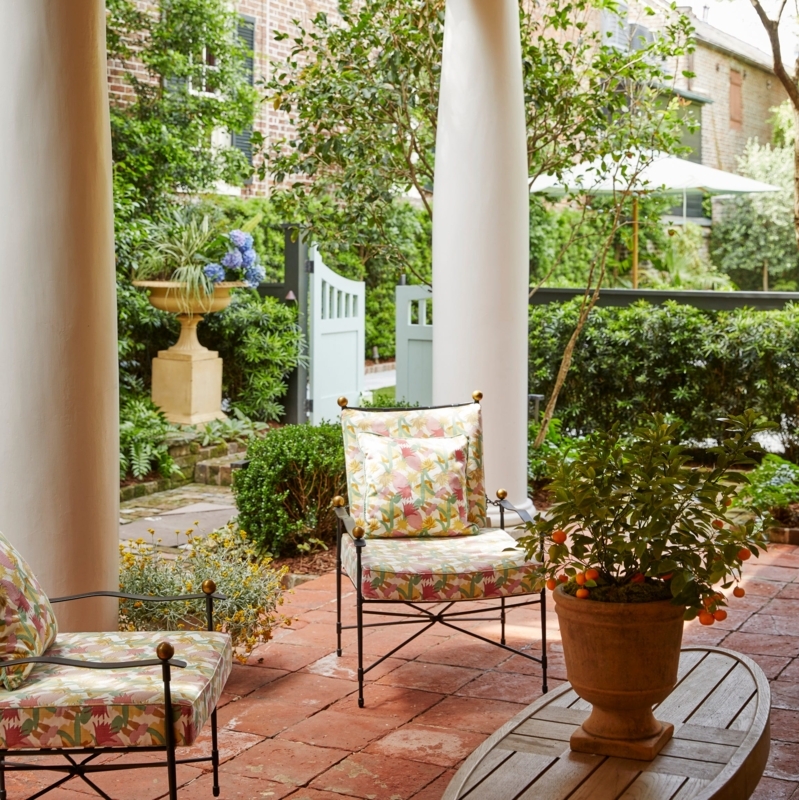Floral Outdoor Lounge Chairs in Traditional Garden Courtyard