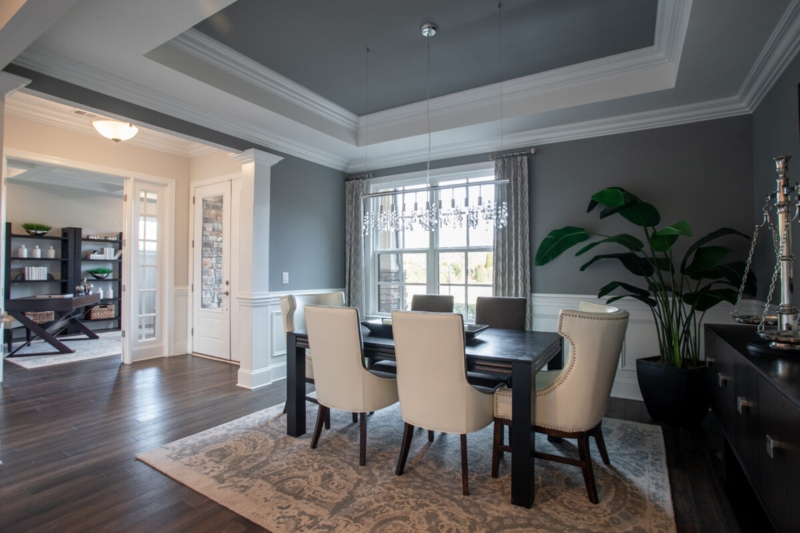 Formal Dining Room with Dark Grey Tray Ceiling & White Wainscoting