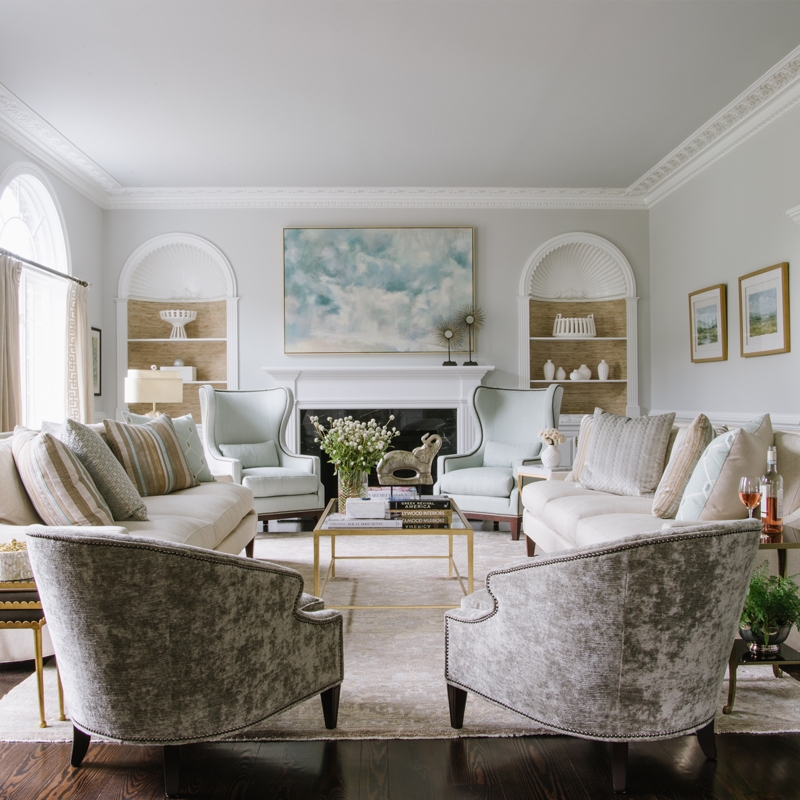 Formal Living Room Layout: Symmetrical Seating & Arched Built-ins.