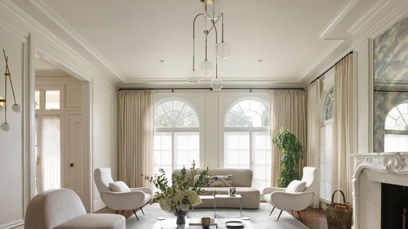 Formal Living Room with Arched Windows & Sculptural Globe Chandelier
