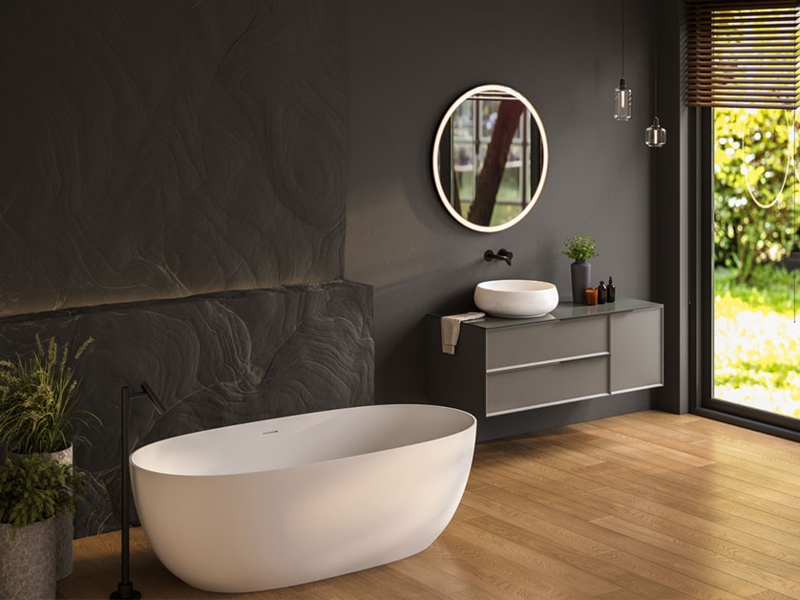 Freestanding Bathtub against Charcoal Grey Textured Stone Accent Wall