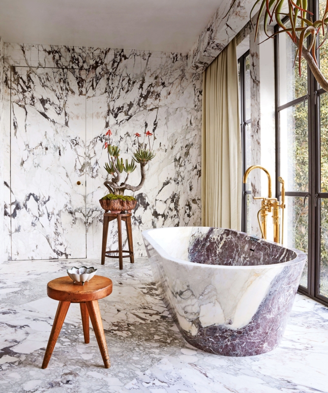 Freestanding Bathtub in Dramatic Bookmatched Marble Wall Bathroom