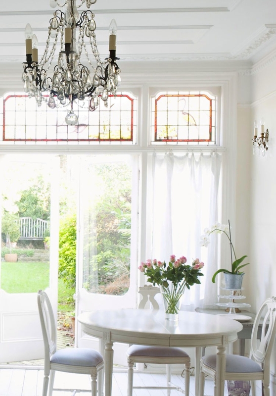 French Country Breakfast Nook with stained glass transoms.