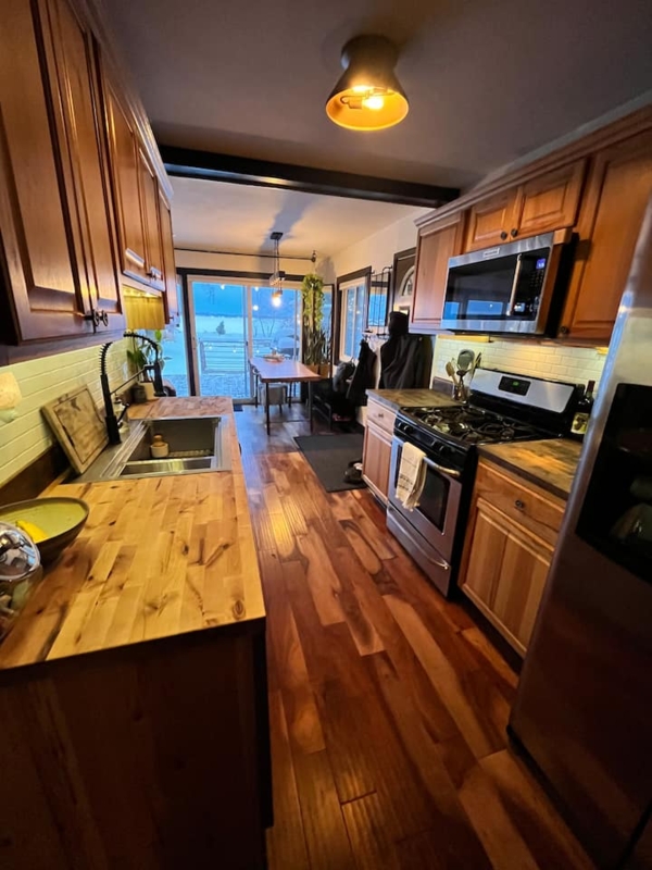 Galley Kitchen Layout with Butcher Block Countertops and Cabinets