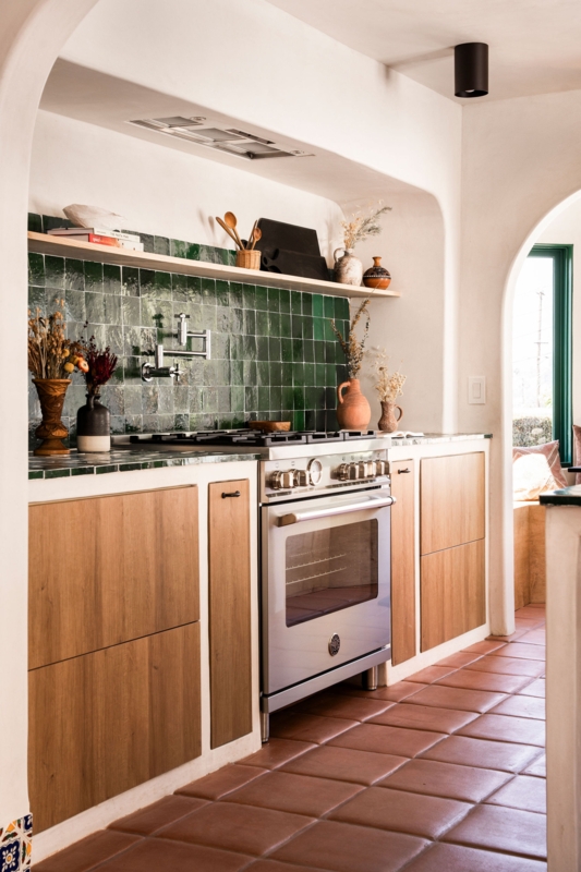 Gas Range with Green Zellige Backsplash and Pot Filler in a Spanish Kitchen.