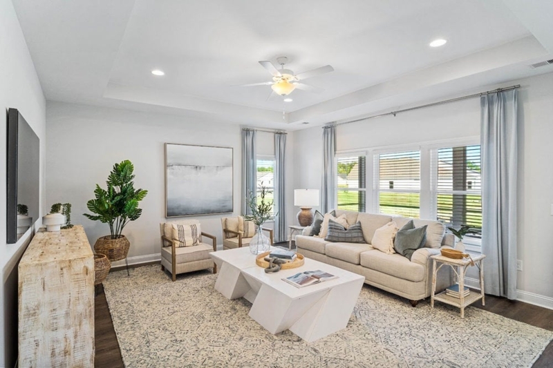 Geometric White Coffee Table in Coastal Living Room with Tray Ceiling
