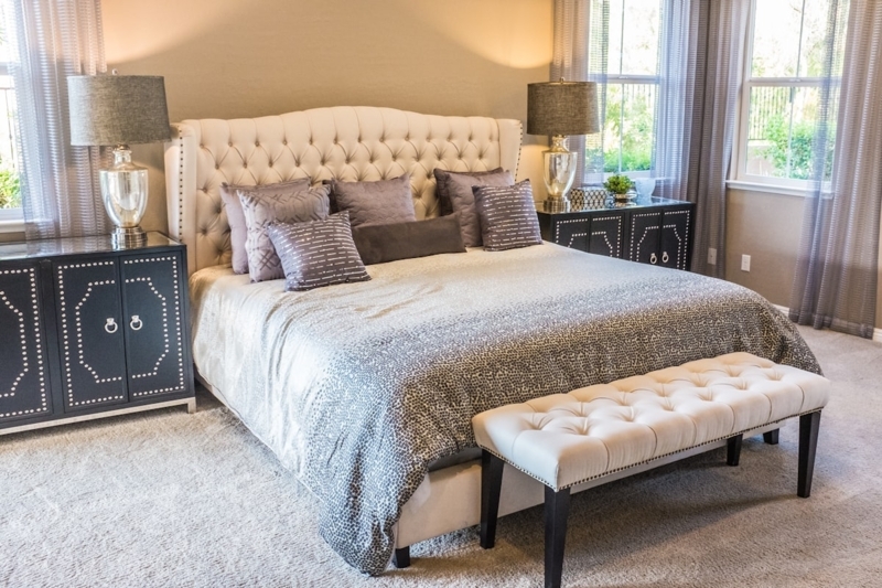 Glam Bedroom with Tufted Wingback Headboard & Studded Chest Nightstands