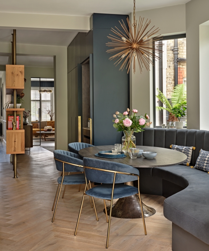 Glam Dining Nook featuring Gold Starburst Chandelier and Navy Velvet