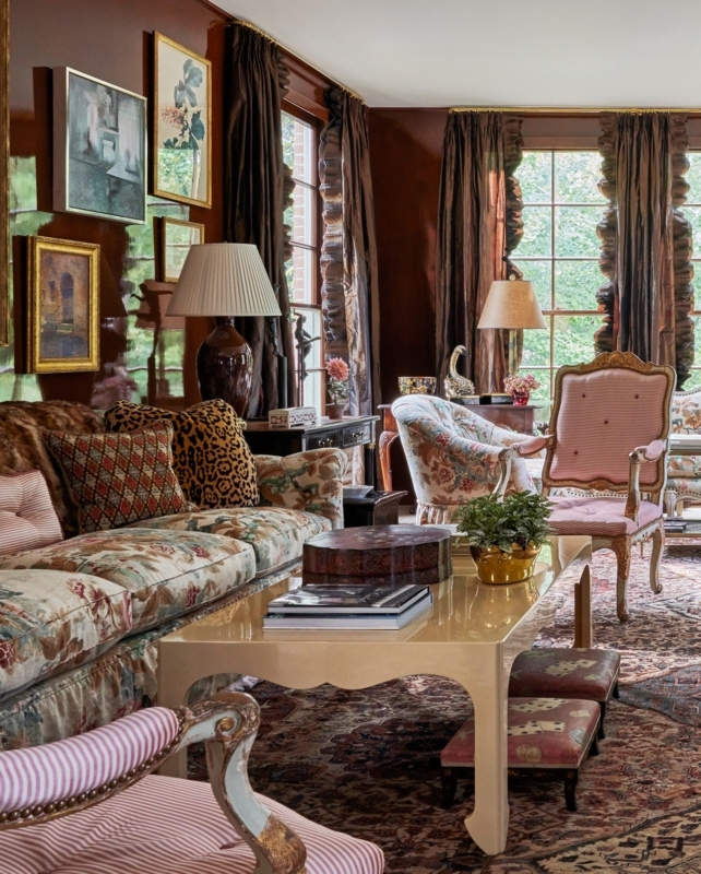 Glossy Chocolate Brown Walls with Floral Sofa & Leopard Print Pillows