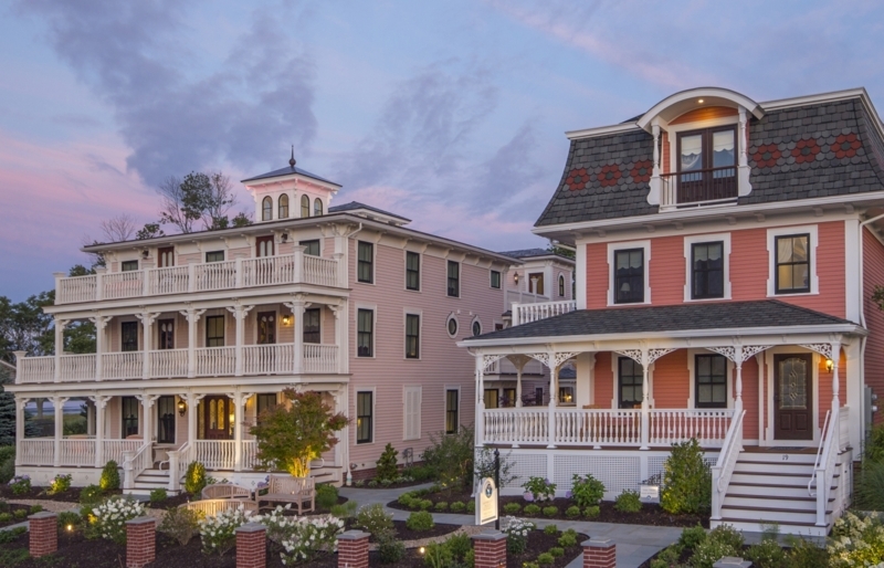 Grand Coastal Guesthouse Exterior Pastel Siding Wraparound Porches