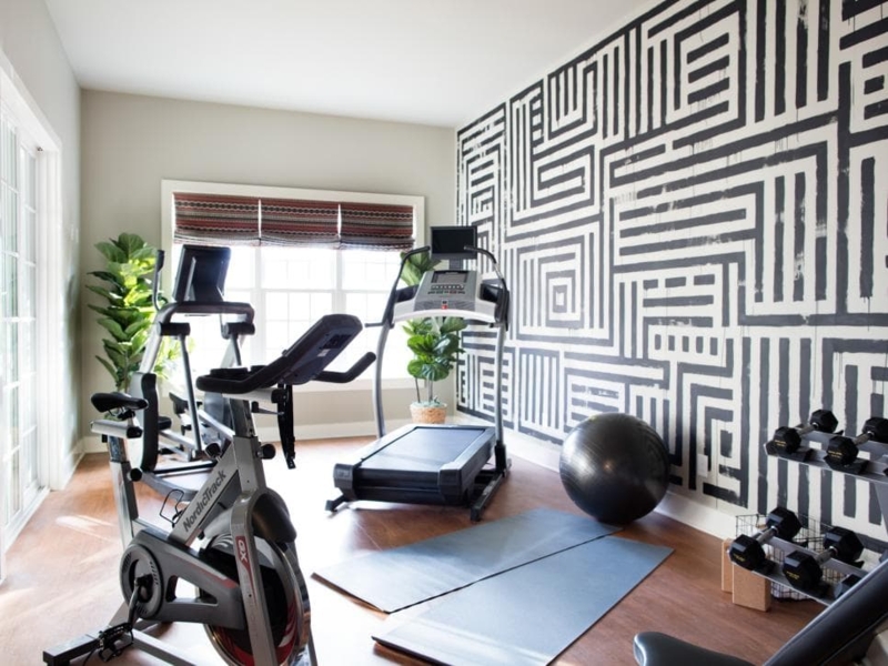Graphic Home Gym Featuring A Bold Geometric Wall Mural