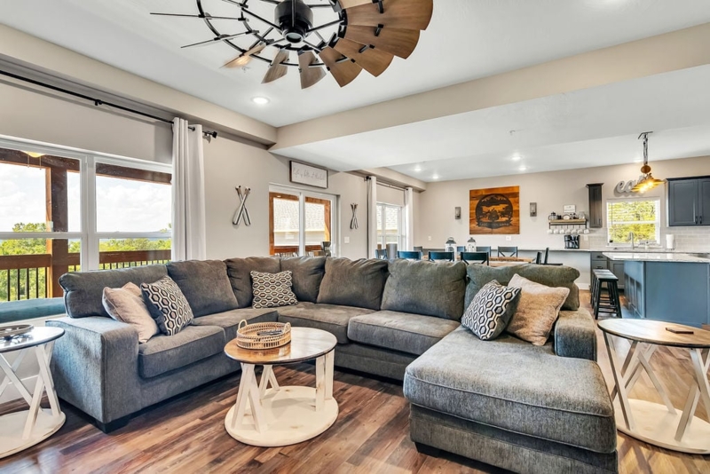 Gray Sectional Sofa in Open Plan Living Room with Windmill Fan