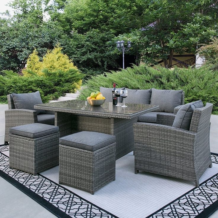 Grey Wicker Outdoor Dining Set with Hybrid Lounge Design and Ottoman Stools