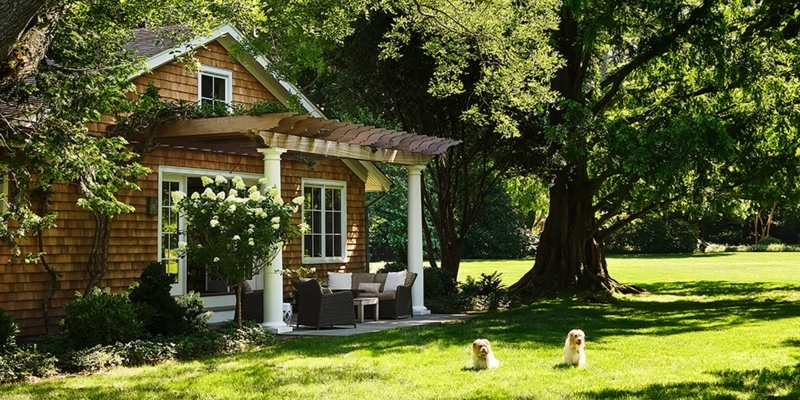 Guest Cottage Patio with Expansive Landscaped Lawn and Pergola
