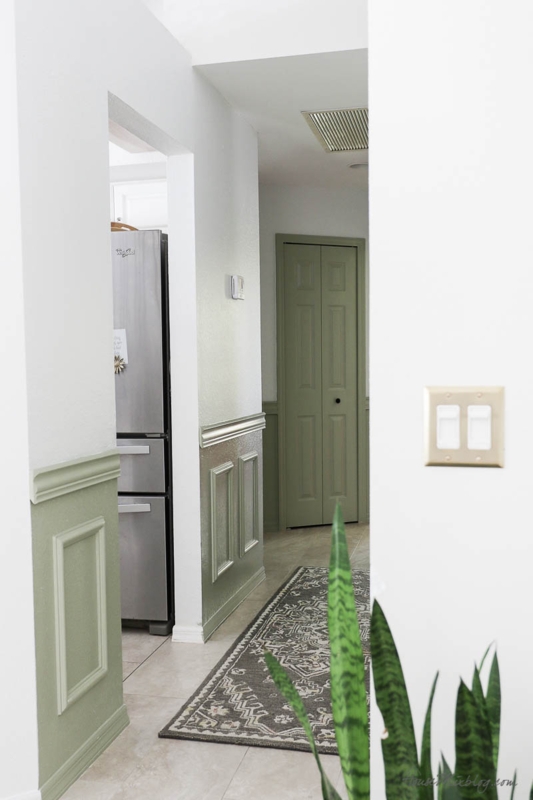 Hallway with Picture Frame Molding and Matching Bifold Doors