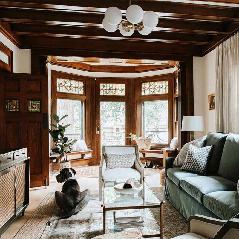 Historic Living Room with Dark Wood Coffered Ceiling & Stained Glass