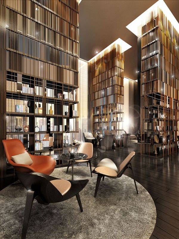 Home Library with Architectural Bookshelf Dividers and Orange Chair