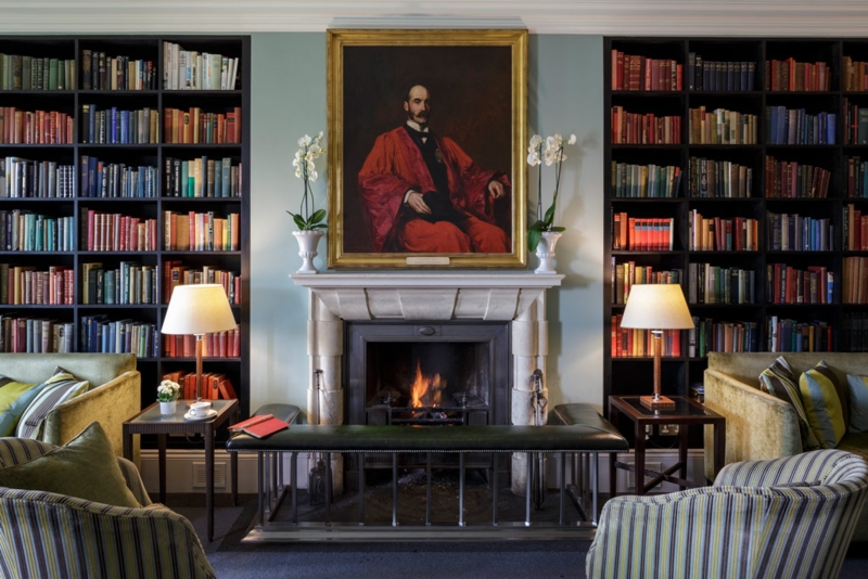 Home Library with Black Built-in Bookshelves and Club Fender Bench