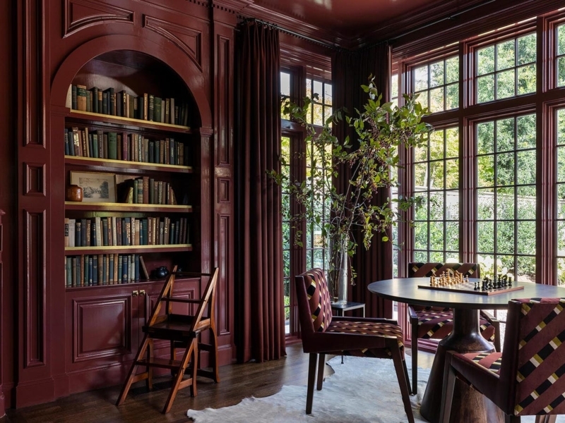 Home Library with High-Gloss Red Lacquer and Arched Bookshelf Niche