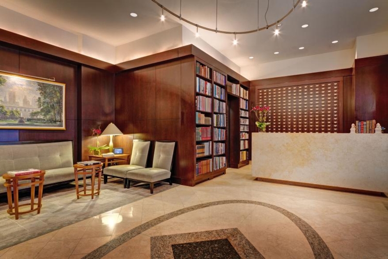 Hotel Lobby Library with Stone Front Reception Desk and Floor Inlay