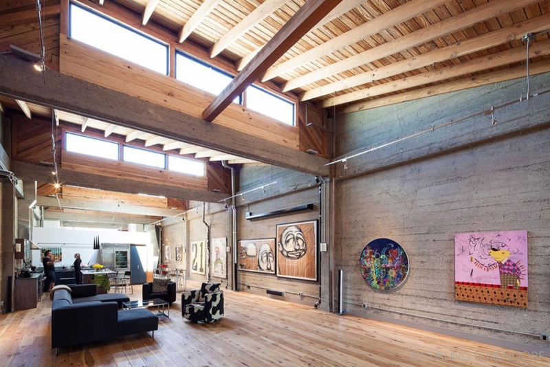 Industrial Loft Living Room: Exposed Wood Beams & Concrete Art Walls
