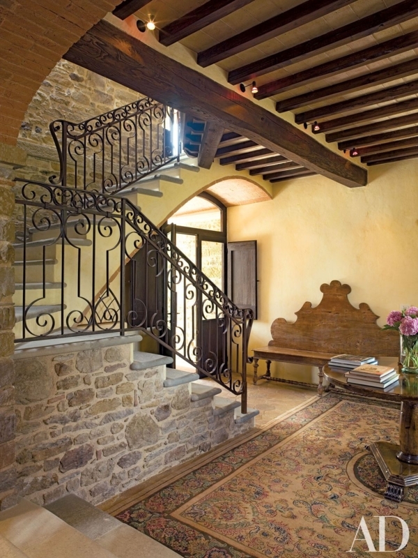 Italian Entryway Design: Scrolled Iron Railing & Stone Walls