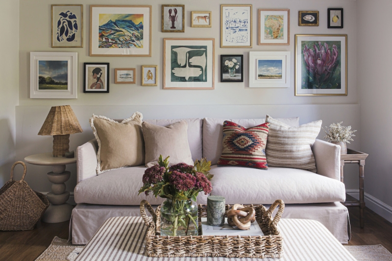 Living Room Eclectic Gallery Wall with Striped Ottoman Coffee Table