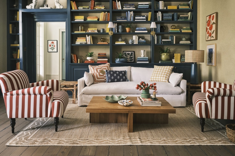 Living Room Library with Navy Built-Ins & Striped Accent Chairs