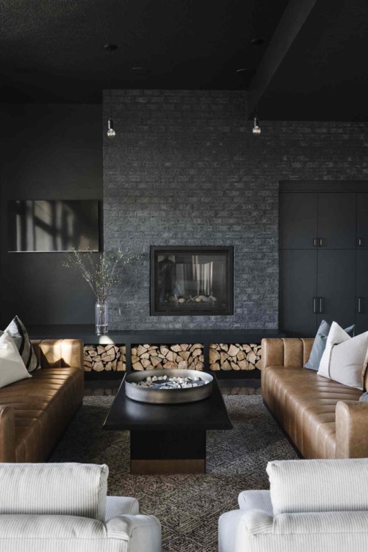 Living Room Moody Black Brick Fireplace with Tan Leather Sofas