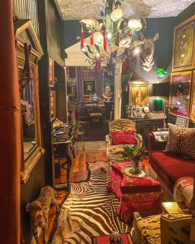 Living Room: Velvet Sofa and Animal Print Rug, Floral Glass Chandelier