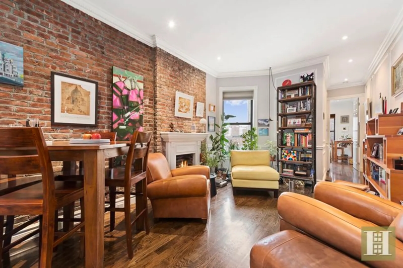 Living Room with a Floor-to-Ceiling Brick Wall Feature